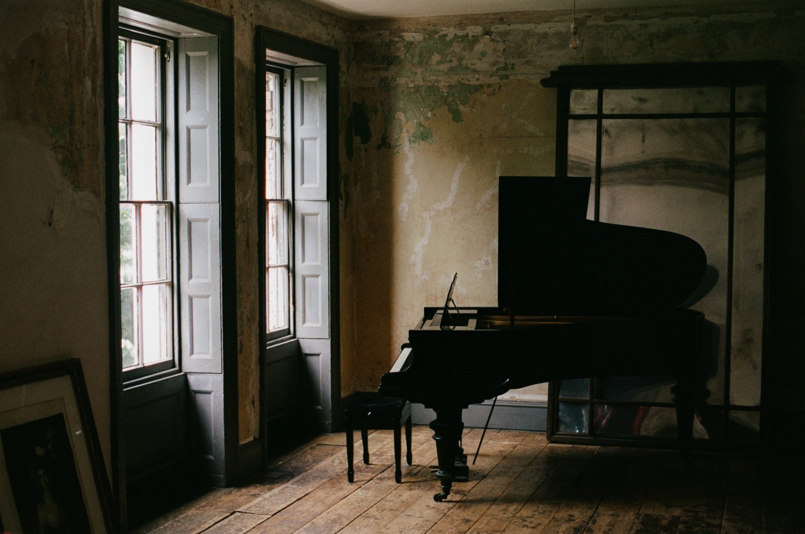 Grand piano in a sunlit room
